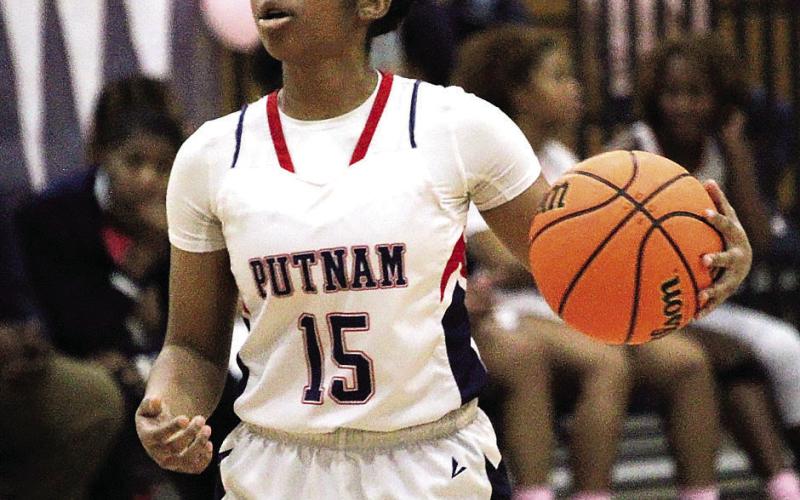 Putnam point guard Melody Richardson (15) moves the ball up court in a recent game. TREY NORRIS/Staff