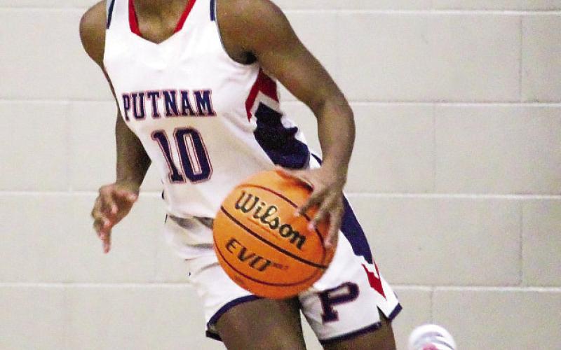 Freshman Journey Waller (10) brings the ball up the court in transition at home against Butler last Tuesday. TREY NORRIS/Staff