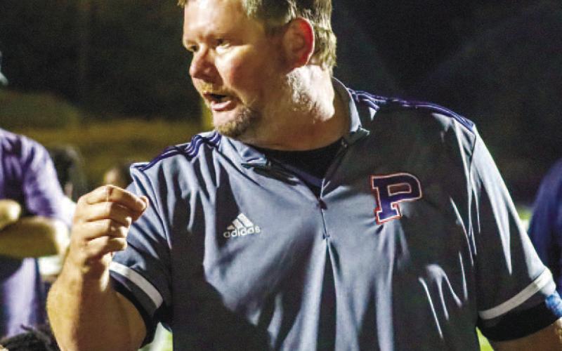 Putnam County head coach Shaun Pope talks to his players after a Region 4-AAA win over Josey earlier this season. LANCE MCCURLEY/Staff