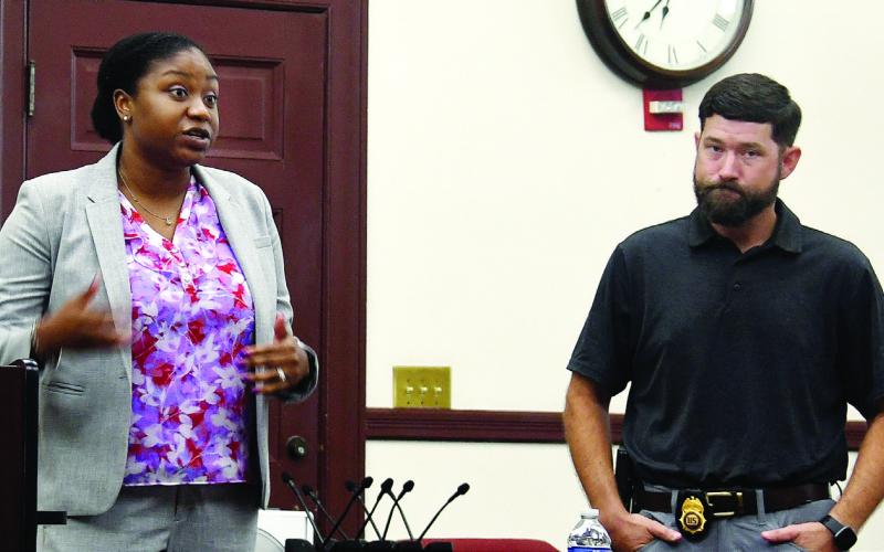 Acting U.S. Attorney Shanelle Booker and Middle Georgia DEA Special Agent Tyler Vandenburg, both from Macon, described efforts to rein in opioid abuse and illicit trafficking. IAN TOCHER/Staff