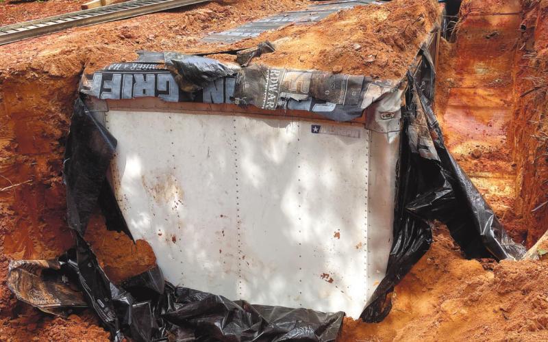 The stolen box truck body was covered in waterproof tarp before it was buried. CONTRIBUTED/Sheriff Howard Sills