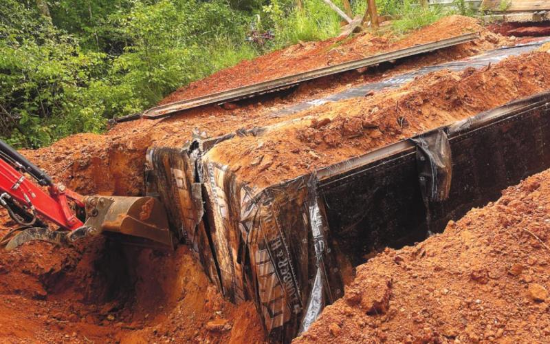 Authorities excavate the buried box truck body. CONTRIBUTED/Sheriff Howard Sills