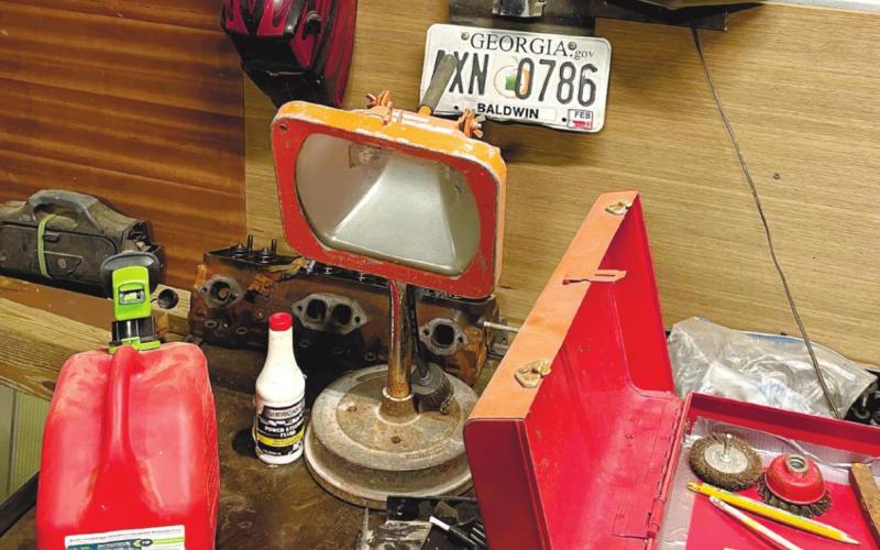 The stolen truck’s tag discovered by authorities mounted on the workbench of a metal shop on Sparrow Way in Putnam County. CONTRIBUTED/Sheriff Howard Sills