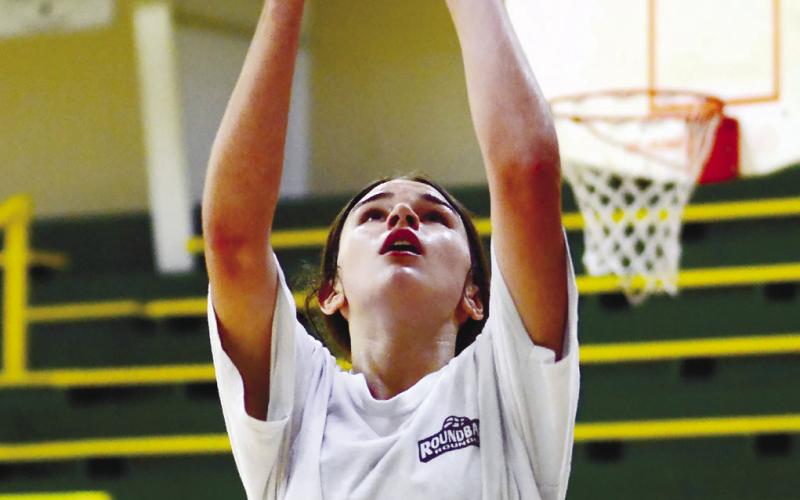 Lauren Paxson goes up for layup during shooting drills. IAN TOCHER/Staff