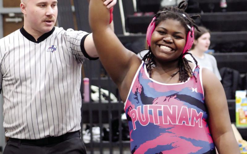 Putnam County’s Kannericka Nelson smiles after winning a match at the area duals tournament on Jan. 10. KIM CASH/Contributed