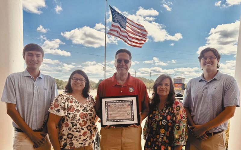 Lake Oconee Elks Lodge No. 2849 awarded a Certificate of Honor to Farmers &amp;amp; Merchants Bank for properly flying the U.S. flag 24/7 throughout the day and night with proper illumination. L-R: Browning Benton Lender, Alicia Bailey, Elks Exalted Ruler Chuck Brake, Linda Moore, and T. J. McElhenney. CONTRIBUTED