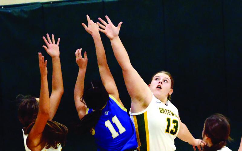 Gatewood senior London Darden (left) is joined by freshman Avery Hill (13) in defending the basket last Friday versis Brentwood. IAN TOCHER/Staff