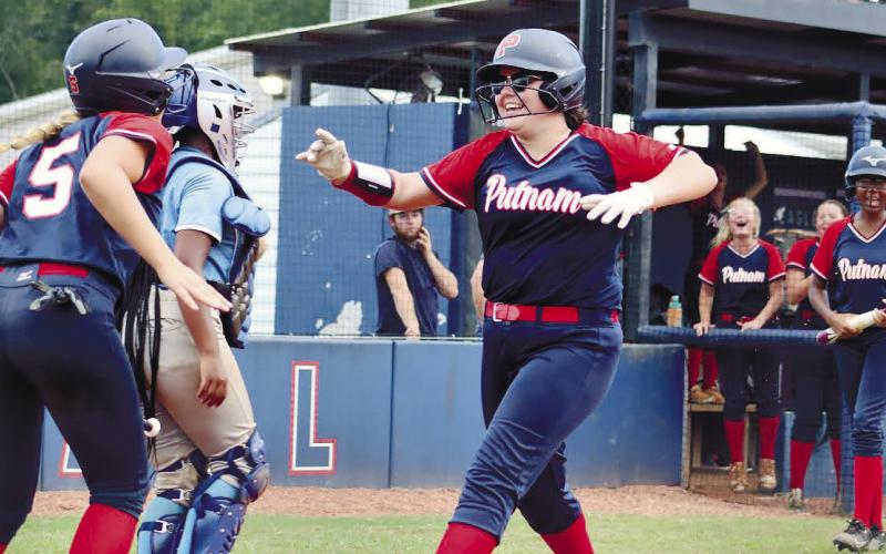 Anslee Bailey and Cherish Rowell celebrate Putnam County’s win.