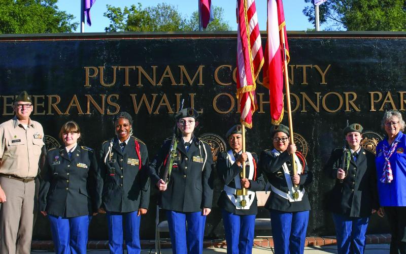 Putnam County High School’s MSgt. Michael Taylor (left) led several Junior Reserve Officers’ Training Corps (JROTC) members who served as the color guard last Thursday for the 9/11 remembrance ceremony at the Putnam County Veterans Wall of Honor Park in Eatonton. IAN TOCHER/Staff
