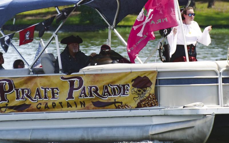 Jerry Arnold (left and above) successfully completed his 12th year as Lake Sinclair Pirate Parade captain this past Saturday.
