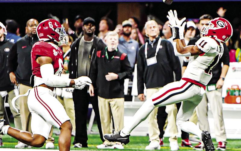 Georgia wide receiver Arian Smith (11) got into the action during the SEC Championship game against Alabama on a 51-yard reception. CHARLES JORDAN/Staff
