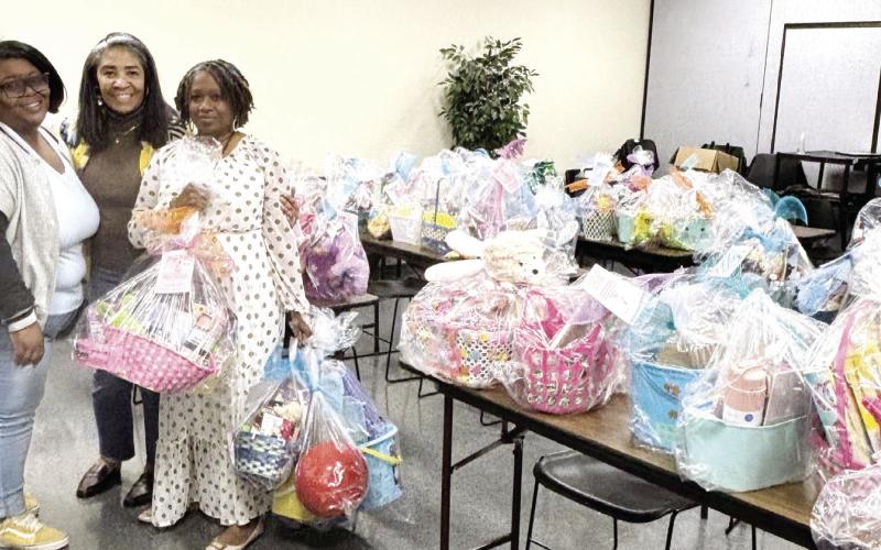 DFCS coordinators carefully organized and distributed Easter baskets for last year’s event, ensuring children in foster care and those in need experience the joy of the season. CONTRIBUTED