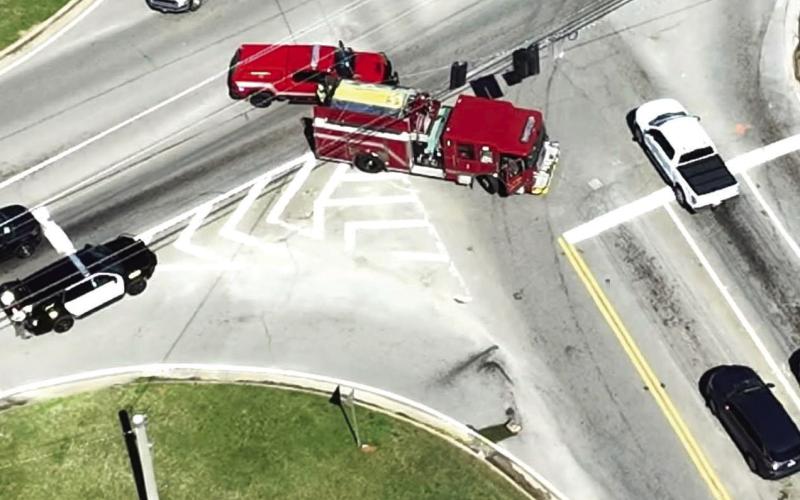 A smoking box is seen in the turn lane where county public safety workers block traffic at the corner of Old Phoenix Road and GA-44. CONTRIBUTED/PCFD