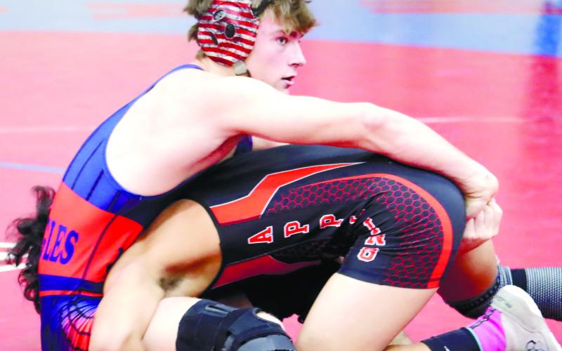 Mark Winslette attempts to pin an opponent during a match last season. ARELLA CASH/File photo