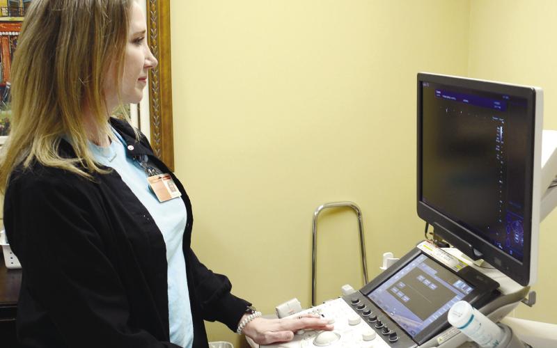 Tracy Askew, a registered diagnostic medical sonographer and registered vascular technologist, performs scans and interprets results from the ultrasound machine. IAN TOCHER/Staff
