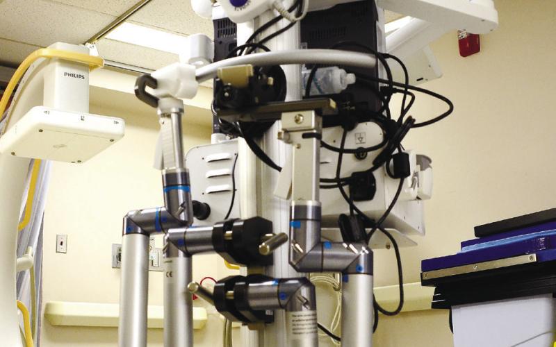 A “robot surgeon” at PGH with tube-like arms (foreground) can perform delicate gallbladder surgery using very thin, high-pressure streams of saline to cut out diseased tissue, among other uses. IAN TOCHER/Staff