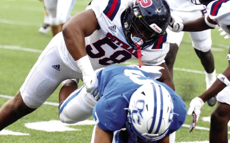 Mark Watkins (58) was a Second-Team defensive selection as a linebacker. LANCE MCCURLEY/Staff