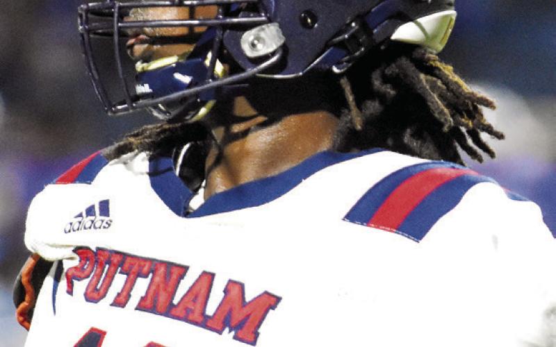 Tyson Waller (11) was a First-Team defensive selection as a linebacker. LANCE MCCURLEY/Staff