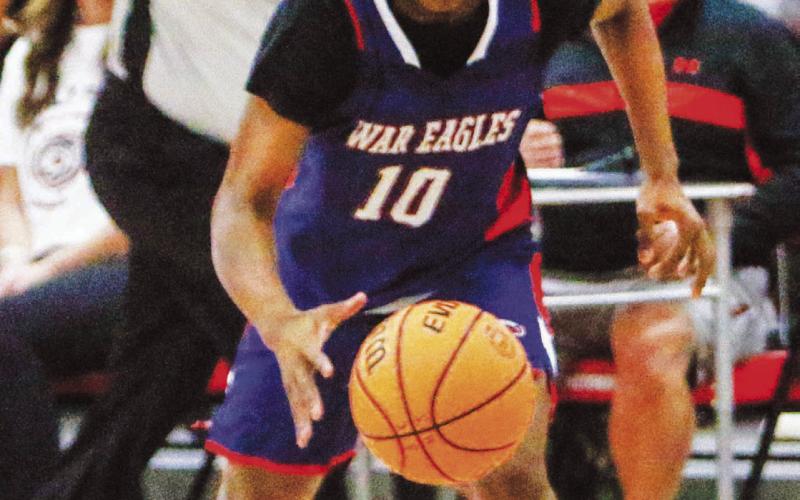 Tamaud Woodson (10) scored 28 points in Putnam County’s 100-94 double overtime win over Towers in the semifinal round of the region tournament. He scored 13 points in the region title game against Greenforest. LANCE MCCURLEY/Staff