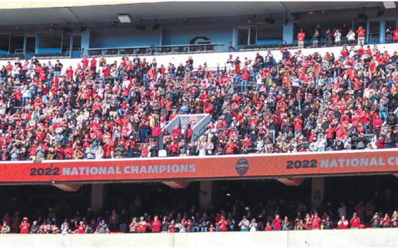 Fans in the upper deck level of Sanford Stadium cheer as the Bulldogs enter Dooley Field. LANCE MCCURLEY/Staff
