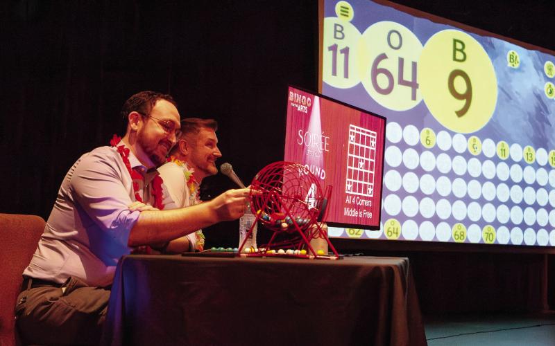 Festival Hall Board Chairman Blayne May rolled the numbers while Board Vice Chairman Justin Cullifer called them out. (LEIGH LOFGREN/Staff)