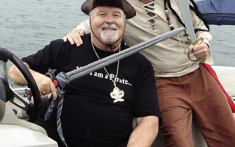 Veteran pirate and parade organizer Emmett “Jerry” Arnold (left) and his buddy Robert Burnsed led the Pirate Parade flotilla into Crooked Creek Marina.