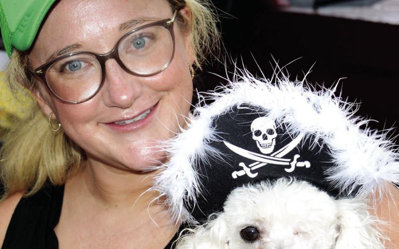 Christine Odom holds Best Pirate Pet “Murphy” following the awards ceremony.