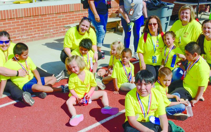 Student-athletes from Putnam County Primary School stood out under the bright sunshine in their yellow War Eagle Games t-shirts.