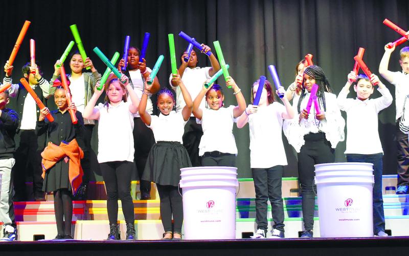 Fourth-grade students perform the melody line of “I Feel Good” by James Brown on Boomwhacker percussion tubes. LENA HENSLEY/Staff