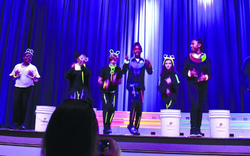 PCES students dance in outfits decorated with glow sticks. LENA HENSLEY/Staff3