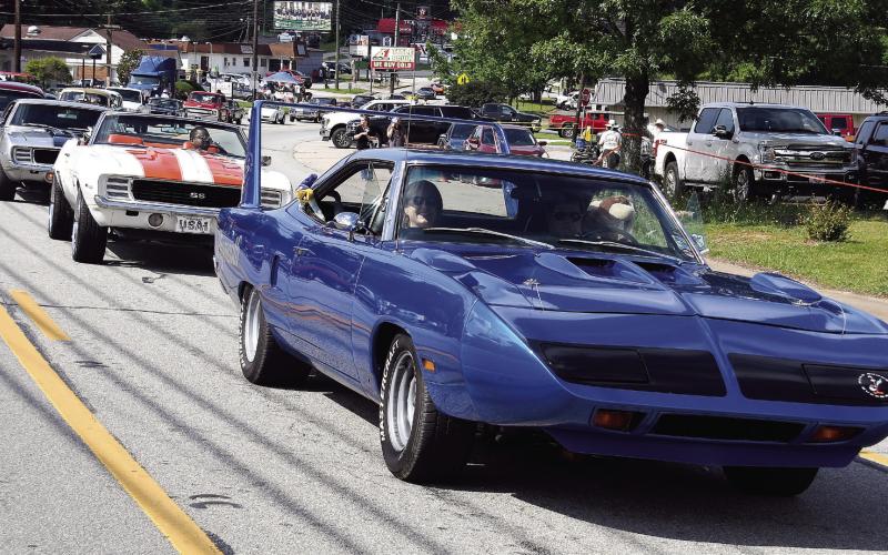 Classic cars parade through Downtown Eatonton during the Putnam County Dairy Festival. IAN TOCHER/Staff