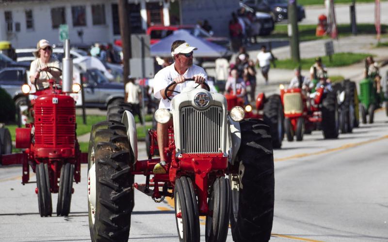 Tractors take a break from the fields to parade through Eatonton. IAN TOCHER/Staff
