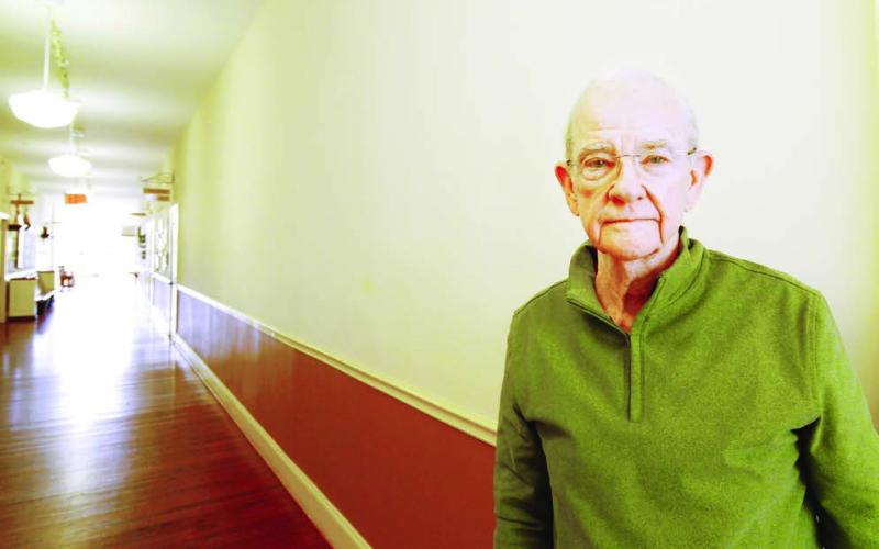Tom Rosseter stands in front of what will soon be the Old School History Museum Wall of Fame, where an inaugural class of 11 Putnam County-based Hall of Fame members will be forever commemorated at The Plaza Arts Center in Eatonton. IAN TOCHER/Staff