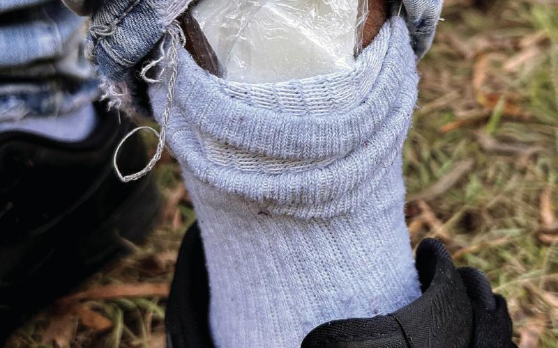 Bagged cocaine is seen in the cuff of Omar Andrews as he was being arrested for an active warrant. CONTRIBUTED/EPD