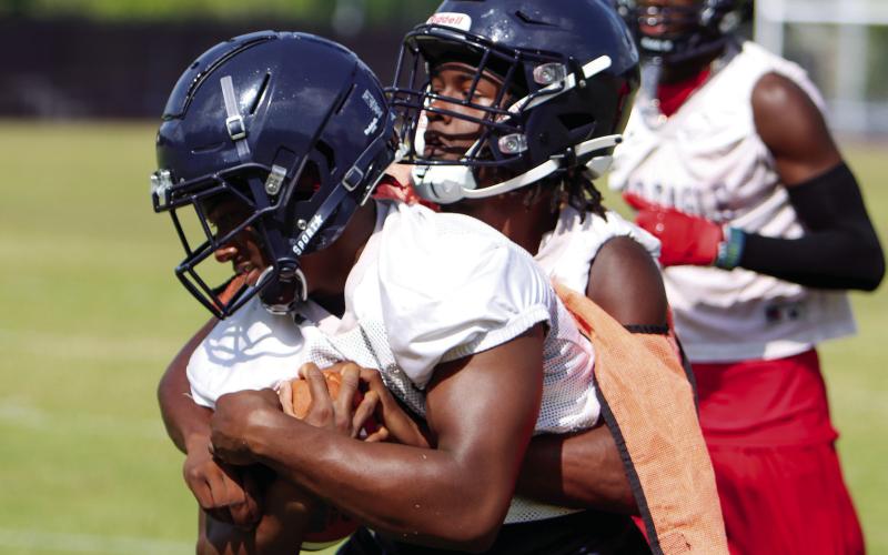 Two Putnam County players participate in a contact drill during a practice in early June. LANCE McCURLEY/Staff