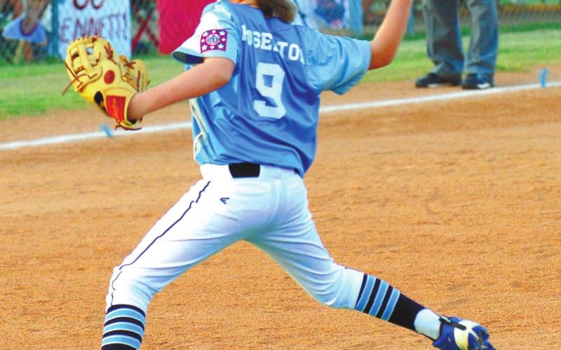 Putnam County hurler Asher Hoselton brings the heat as he opens the first inning of playoffs for his team.