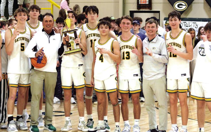 JT Gregory holds the trophy signifying the Gatewood Gators as GIAA 2-AA regular-season champs for the second-straight year. IAN TOCHER/Staff