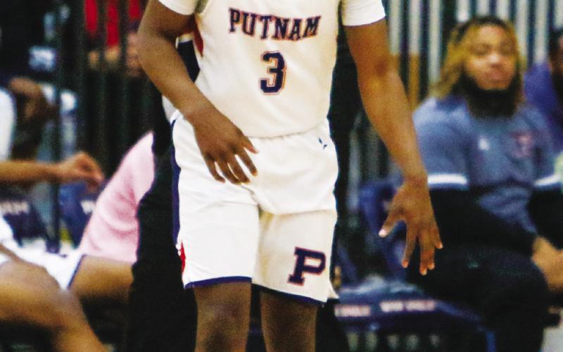 Putnam County guard Jmari Greene brings the ball up the court. LANCE McCURLEY/Staff
