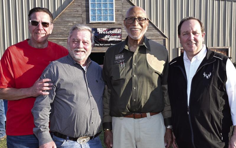 L-R: Chuck Brake of the Lake Oconee Elks Lodge, SCI Director-at-Large and Chapter Vice President James Lakeman, Georgia SCI Chapter President Lester Richardson, and SCI Chief Operating Officer Louie Cole greeted veterans as they entered the Honoring Our Heroes event earlier this month at Briarpatch Farms. CONTRIBUTED