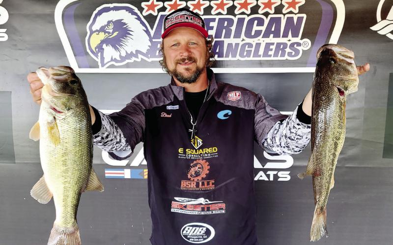 Eatonton’s Brad Stalnaker holds up two of the fish that helped him win an American Bass Anglers Pro League tournament on Lake Oconee last weekend. CONTRIBUTED