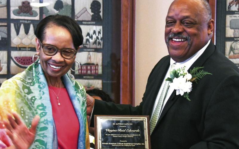 Eatonton native Virginia Reid Edwards received her AACEC award from Eatonton Mayor John Reid, signifying her role as one of the first Black women to be hired as a telephone operator in 1965 by Southern Bell in Atlanta. IAN TOCHER/Staff