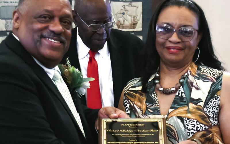 Mayor Reid handed a recognition plaque to the family of Robert Woodson Reid, who in 1966 was killed in action at Pleiku, Vietnam. IAN TOCHER/Staff