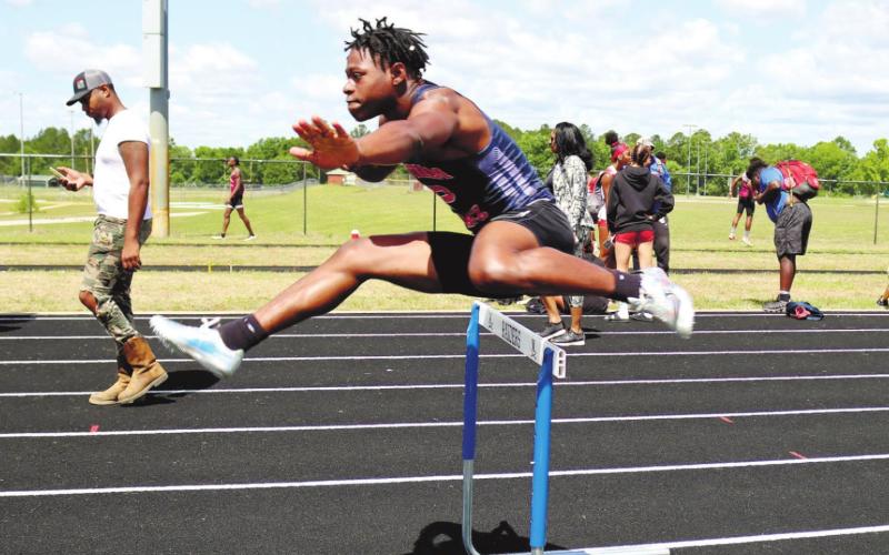 Brayon Farley competes in the hurdles. ARELLA CASH/Staff