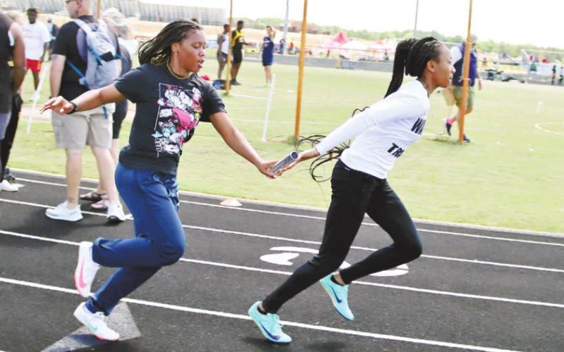 Putnam County girls team warms up for the meet. ARELLA CASH/Staff