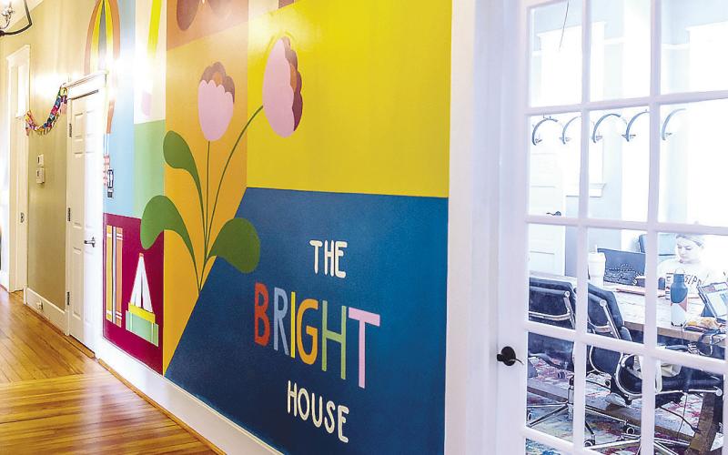 Maggie Morgan’s mural at The Bright House in Baldwin County. The mural features a colorful backdrop for a variety of simple designs hand-selected to represent hope, restoration, transformation, and growth. COURTESY OF GCSU