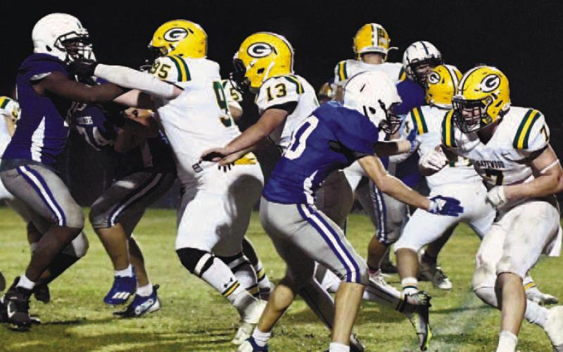 Gatewood quarterback Ames Johnson (10) scrambles behind his offensive line during the GIAA Class AA semifinal game Nov. 25, against Central Fellowship Christian Academy in Macon. DAWN SINCLAIR/Staff