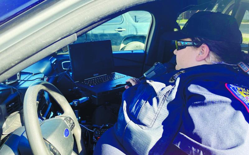 Eatonton Police Department officer Rebecca Meeks shows the new Getac laptop in her patrol vehicle. LYNN HOBBS/Staff
