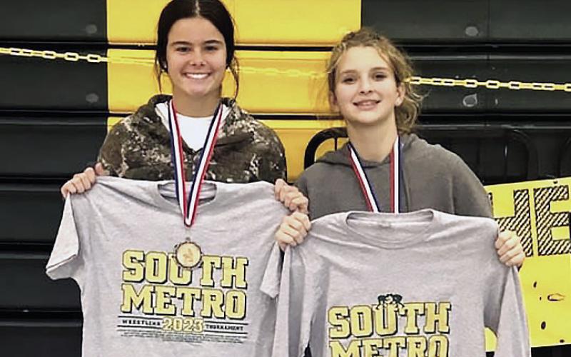 Putnam County's Lily Armistead (left) picked up her weight class win at the South Metro Invitational in Atlanta, while Lily Frisch (right) was second in her weight class.