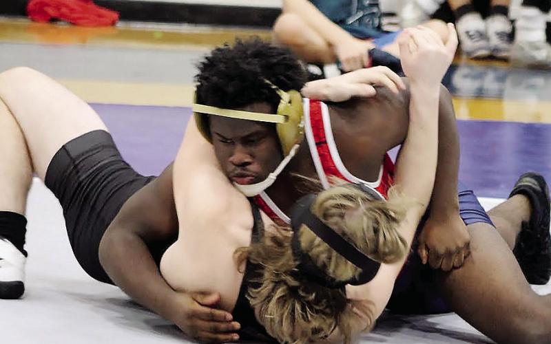 In just his fourth-ever match, up-and-coming JV wrestler TreLei Calhoun (top) performed well Dec. 7 against an Oglethorpe opponent.