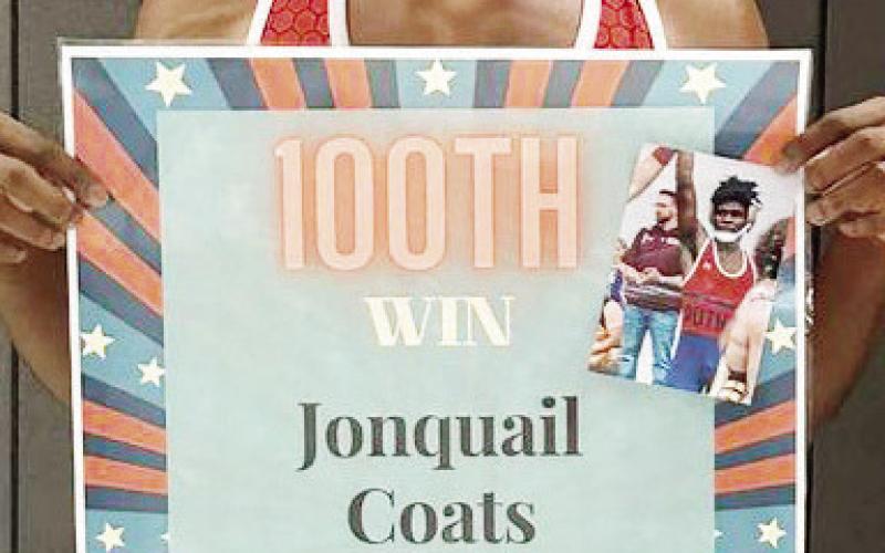 Putnam's Jonquail “Johnnie” Coats won his 100th career match in double overtime.